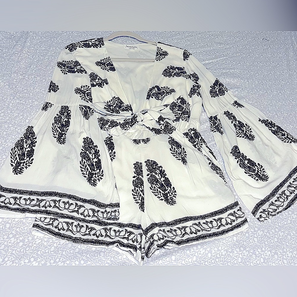 Women’s bell sleeve romper size M fits like S. Gently worn. Brand: Loveriche